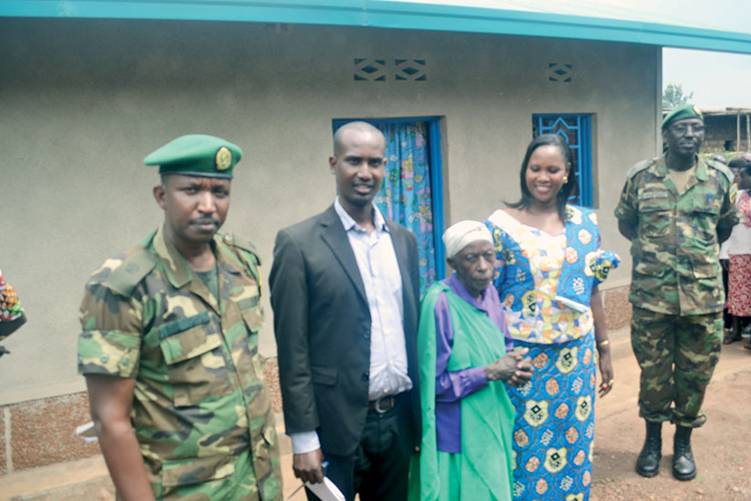 One of the beneficiaries recieving a house in Ngoma District.