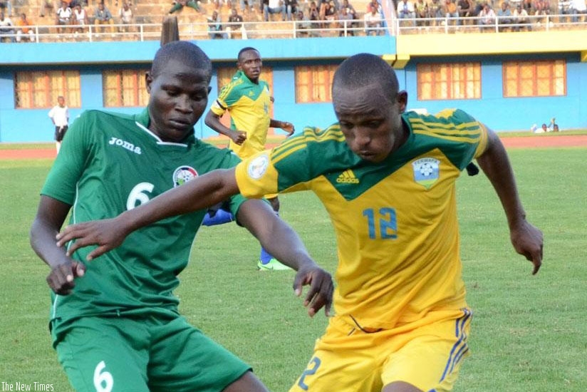 Amavubi midfielder Jean-Claude Iranzi (R) in action against Kenya during the inaugural Genocide memorial tournament in 2015. File.