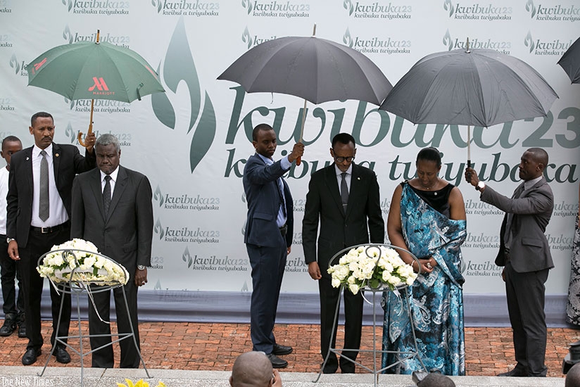 President Kagame and First lady Jeannette Kagame, and the African Union Commission Chairperson Moussa Faki Mahamat (L) lay wreaths in honour of the Genocide victims at Kigali Genoc....