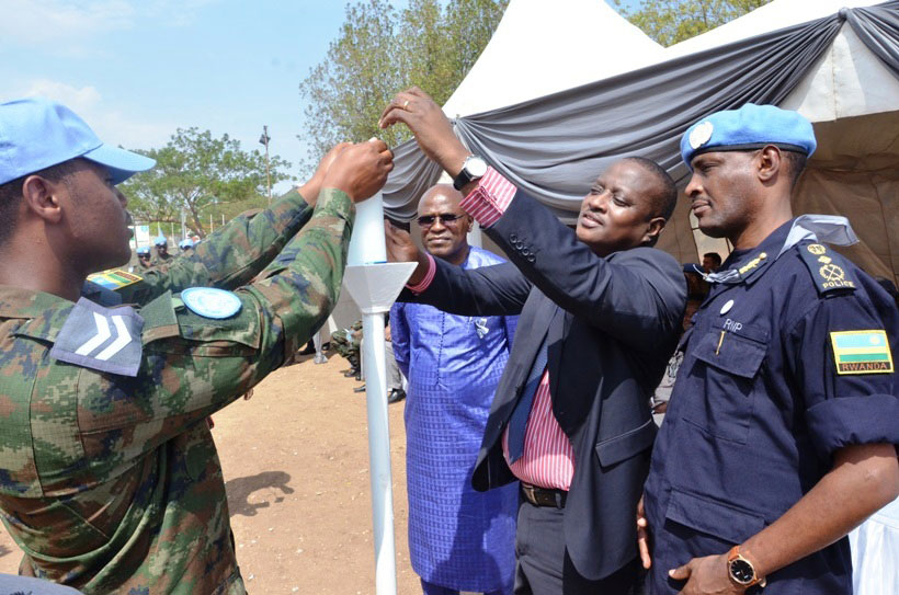 Members of the Rwandan police and military peacekeepers join officials in lighting Flame of Remembrance in the South Sudan capital of Juba, on Friday. The Rwandan police and milita....