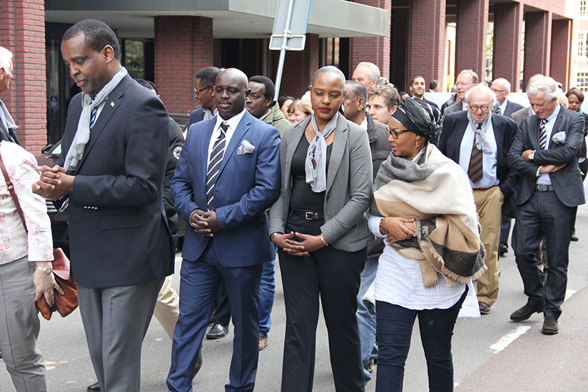 Amb. Karabaranga (L) leads mourners at the commemoration event in The Hague. / Courtesy