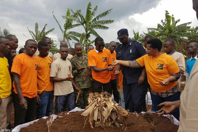 Members of GEARG making a garden for Genocide survivors Nyaruguru District last week.  (Photo by Lydia Atieno)
