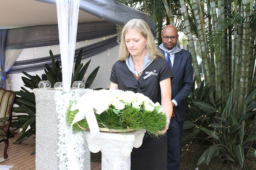 Amb. Barks-Ruggles lays a wreath at the U.S embassy's memorial plaque.  / Courtesy