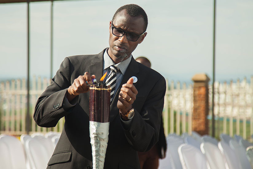 Minister Musafiri lights the Flame of Hope during the event. / Nadege Imbabazi