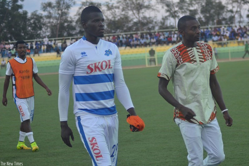 Sibomana with his coach Masudi after a recent league match against Amagaju FC. Net photo.