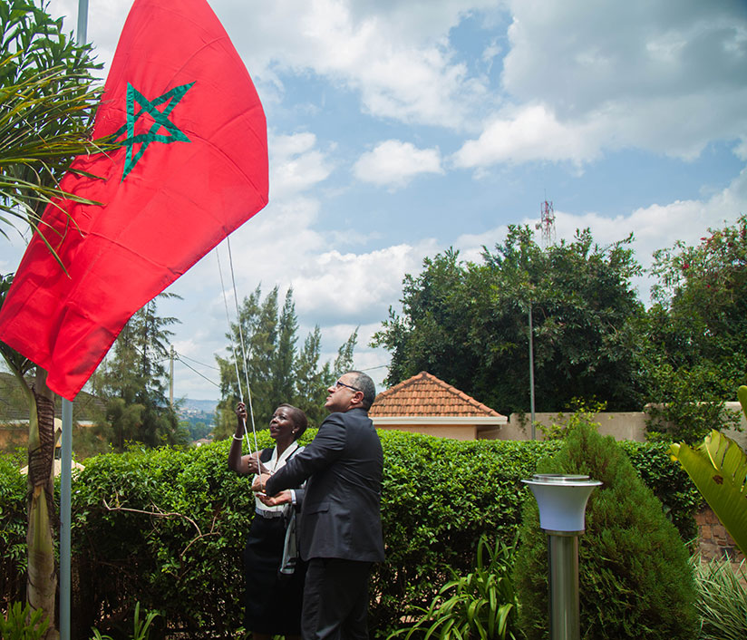 Minister for Foreign Affairs Louise Mushikiwabo and Youssef Imani, the Moroccan Ambassador to Rwanda raise the Moroccan flag at the new embassy in Nyarutarama, Kigali. Nadege Imbabazi.