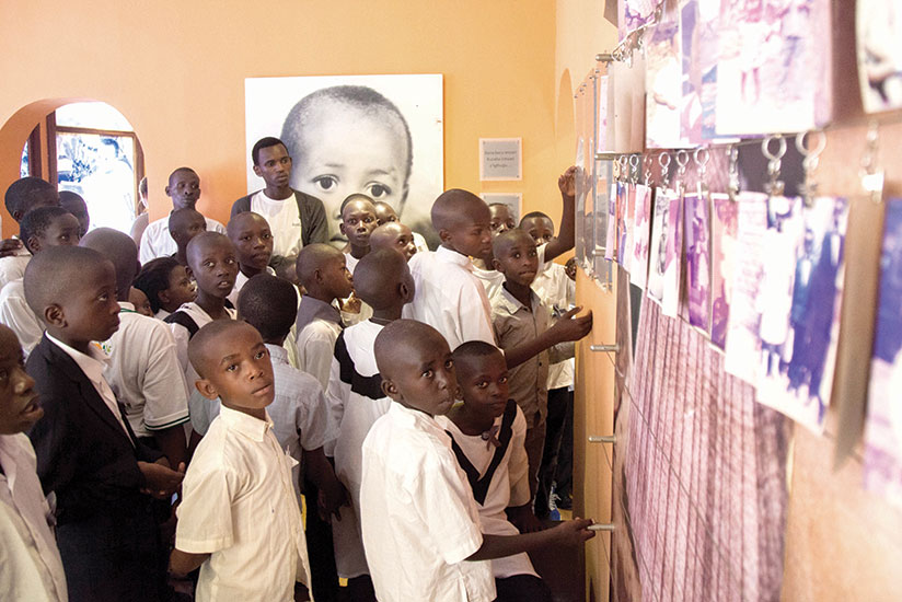 Children from Ndayisenga Fabrice Foundation (NFF) at the Gisozi memorial site in Kigali. The Ministry of Education children in primary schools taught the dangers of genocide ideolo....
