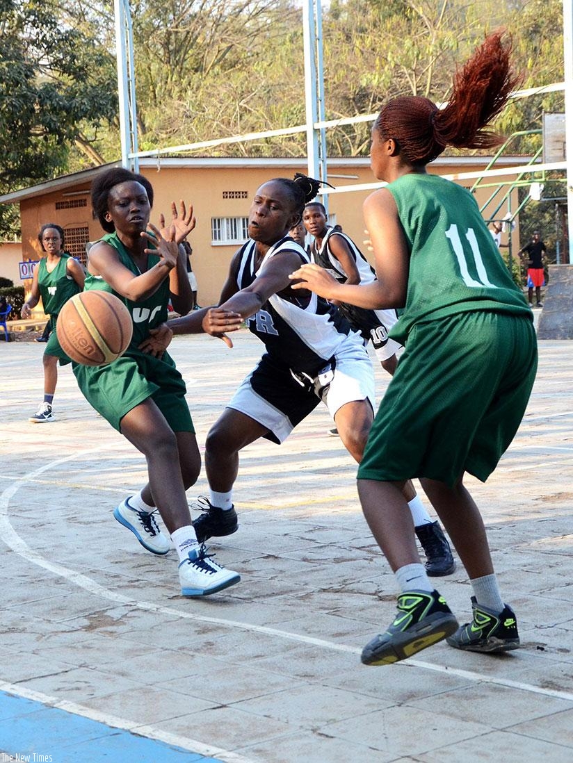 Peace Bamurange, left, seen here playing for NUR against APR in the national women basketball league. S. Ngendahimana