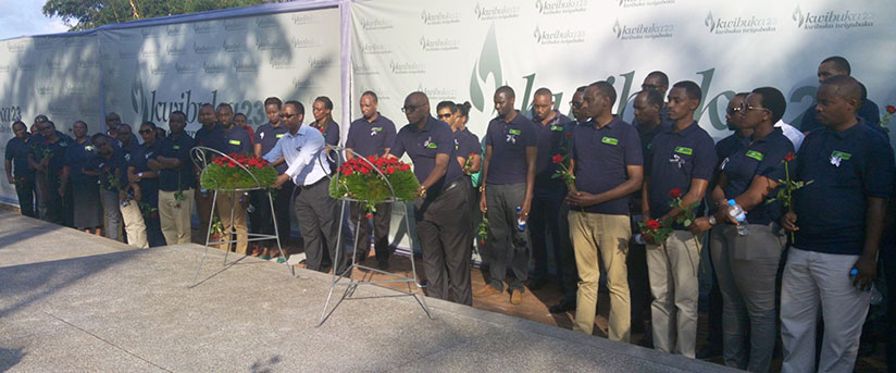 KCB Bank Rwanda staff lay wreaths at Genocide Memorial Centre in Gisozi. They had earlier participated in a 'Walk to Remember' from Kinamba to the centre. / Peterson Tumwebaze