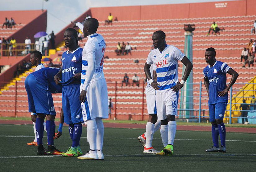 Rayon Sports' Malian striker Tidiane Kone (#15) looks on as right back Fiston Munezero (#2) calls on his team mates during their first playoff round match against Rivers United on ....