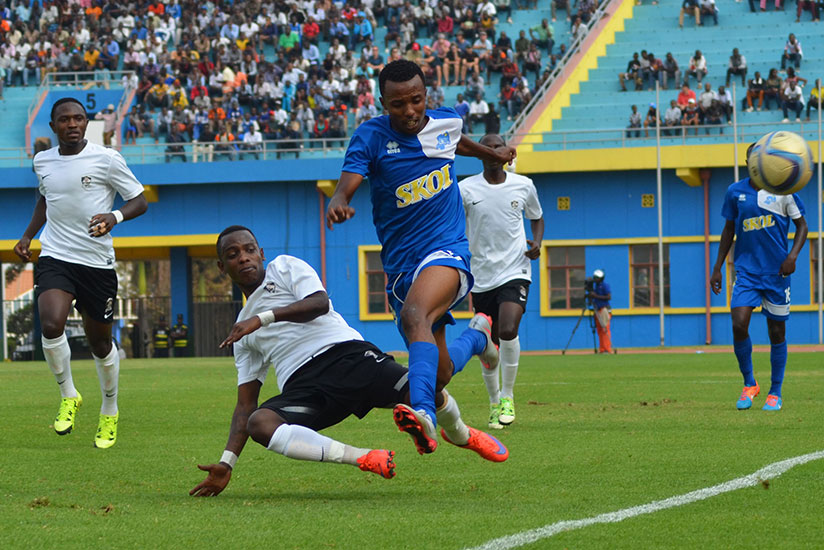 APR left back Michel Rusheshangoga tackles Rayon's winger Savio Nshuti during last year's Peace Cup final at Amahoro stadium (Sam Ngendahimana)