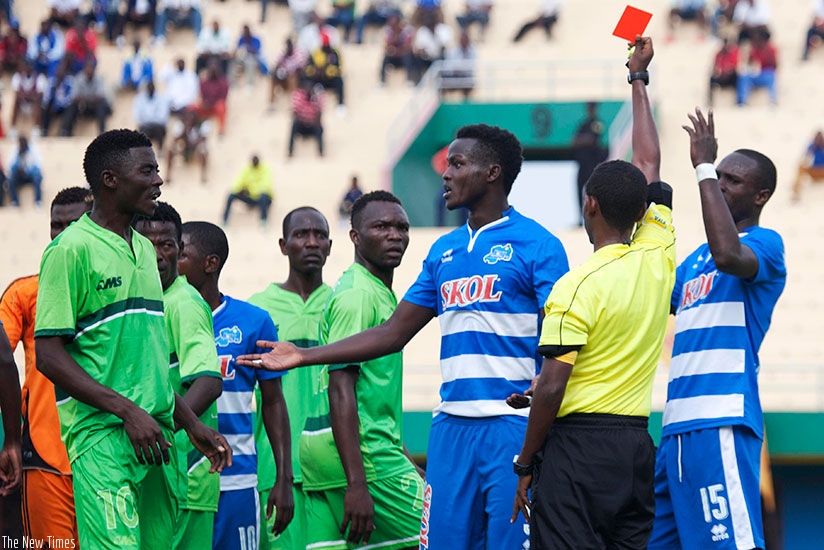 Ethiopian Haileyesus Bazezew Belete shows a red card to Rayon Sports' defender Ange Mutsinzi  against Al Wau Salam of S. Sudan in a previous round. S. Ngendahimana