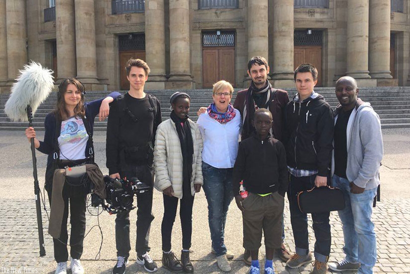 The Rwandan cast poses for photos with the German and Russian film crew.
