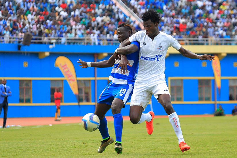 Rayon's Malian striker Tidiane Kone (L) battles with Rivers United defender Joseph Douhadji during the match which ended goalless on Saturday. / Sam Ngendahimana