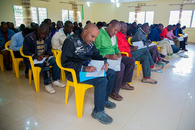 Former FDLR members take notes during a lesson at Mutobo camp in Musanze District. (Photos by Faustin Niyigena)