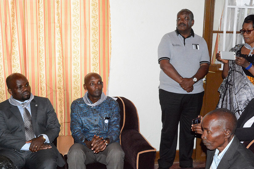 Birikunzira (right) with Nsengimana, Tusabe, Dusingizemungu (standing) and other guests in his new house. / Appolonia Uwanziga 