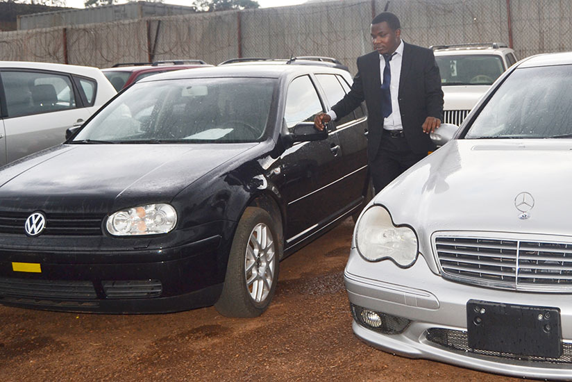 The young entrepreneur at his car bond in Nyarugenge. / John Mbaraga