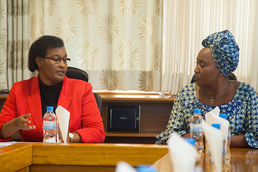 Mukabalisa (L) and Zambia's Mwashingwele chat during the meeting in Kigali, yesterday. / Nadege Imbabazi
