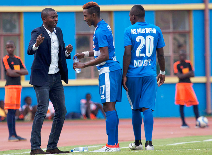 Djuma Masudi giving instructions to one of his midfield stars Fabrice Kakule Mugheni at the touchline.  The Burundian tactician has been given a one-week suspension by the club ove....