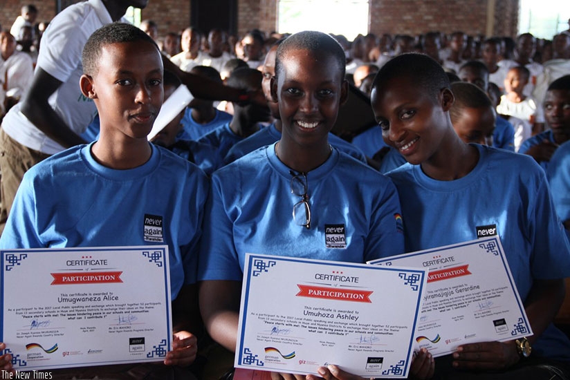Participants with their certificates after the forum at Notre Dame de la Providence Karubanda in Huye District. (Photos by Remy Niyingize)