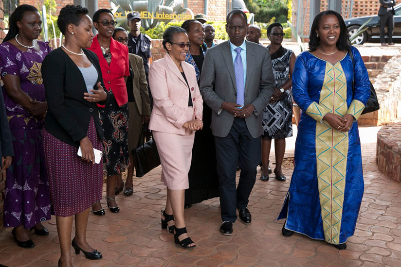 The First Lady of Ethiopia, Roman Tesfaye is joined by Women for Women International Country Director, Uwimana Antoinette (left), Minister of Gender and Family Promotion, Hon Nyirasafari Esperance and Permanent Secretary in the Ministry of Trade and East African Community Affairs, Hon Rosemary Mbabazi (right) observe the women's creative wares during their visit to the Women's Opportunity Centre.