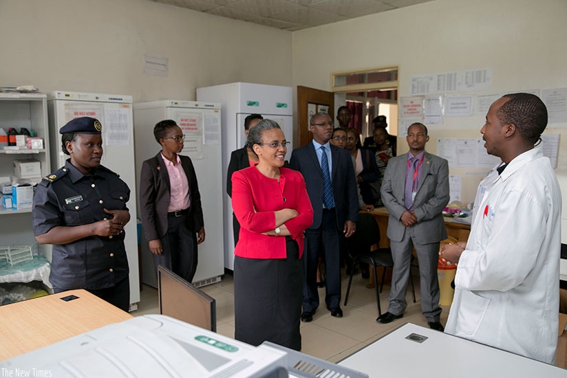 Mrs Tesfaye (C) is briefed about the operations of Isange One Stop Centre during her tour of the facility yesterday. Courtesy.