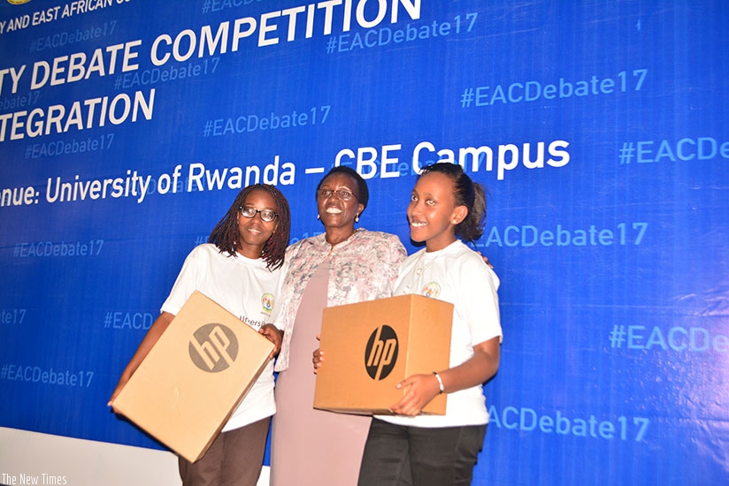 Hon Nyiramirimo, a member of EALA together with winners from Gitwe University