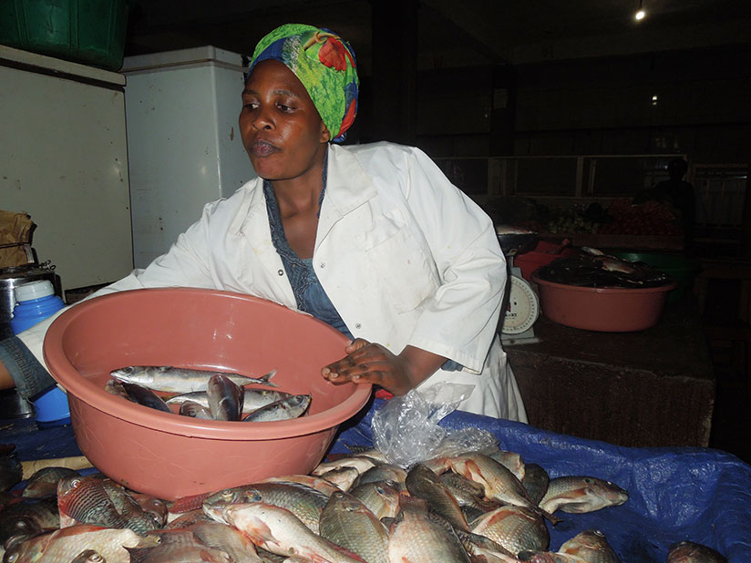 Uwimana sells fish in Ingenzi Market in Huye District. The trader has built a permanent house for her family. / Appolonia Uwanziga