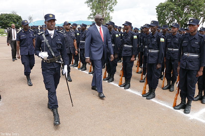 Minister Busingye inspects a guard of honour at the event yesterday. (Courtesy)