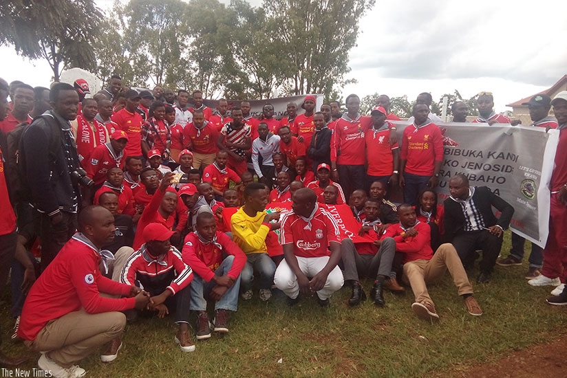 Liverpool fans pose for a group photo after laying a wreath at Mukarange mass grave. (Geoffrey Asiimwe)
