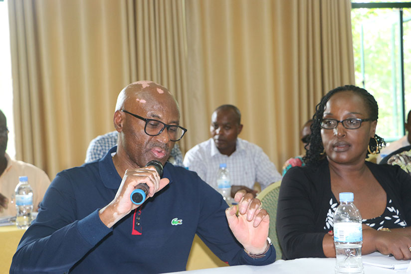 Amb. Valens Munyabagisha, flanked by his deputy Rwemalika, chaired RNOSC extra-ordinary assembly last weekend. / Jejje Muhinde