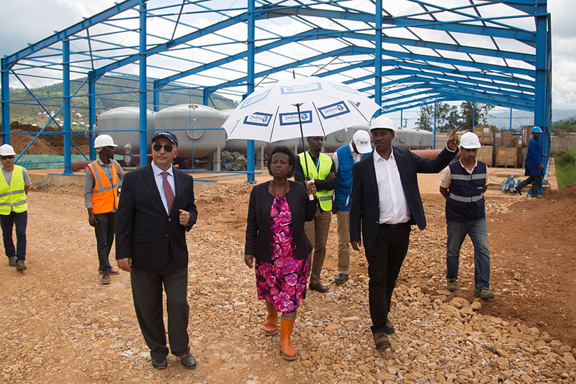 Beyhan Nakiboglu, chief executive of Culligan International EACA (L), Minister Kamayisire (C) and Sano tour the new water plant at Nzove on Friday. / Timothy Kisambira