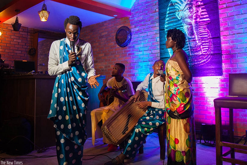 Poet Olivier Tuyisenge (left) and his team reciting some pastoral poems (Amazina y'inka). (File photo)