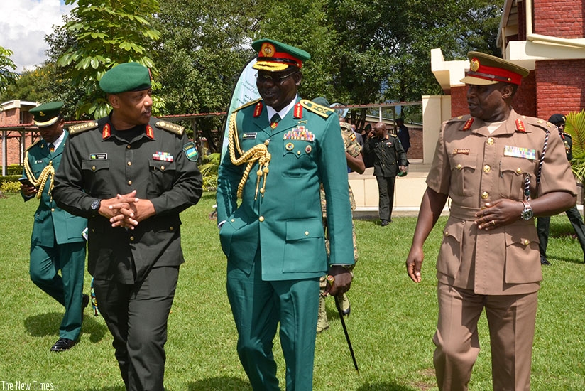 Chief of Defence Staff Gen Patrick Nyamvumba (L) chats with officers from other African states after the opening of the symposium yesterday. (Michel Nkurunziza)
