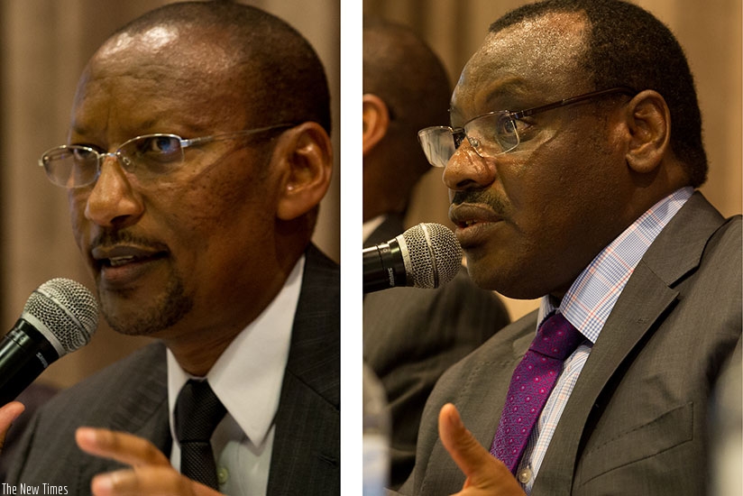 Finance and Economic Planning minister Claver Gatete (R) and central bank governor John Rwangombwa speak during a seminar in Kigali to discuss Rwanda's and the region's outlook yesterday.(Photos by Timothy Kisambira)