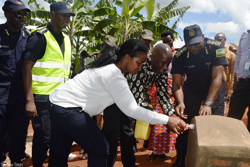 Eastern Province governor Judith Kazayire (L), Kaboneka (C) and Gasana inaugurate clean water source in Kirehe. (Courtesy)