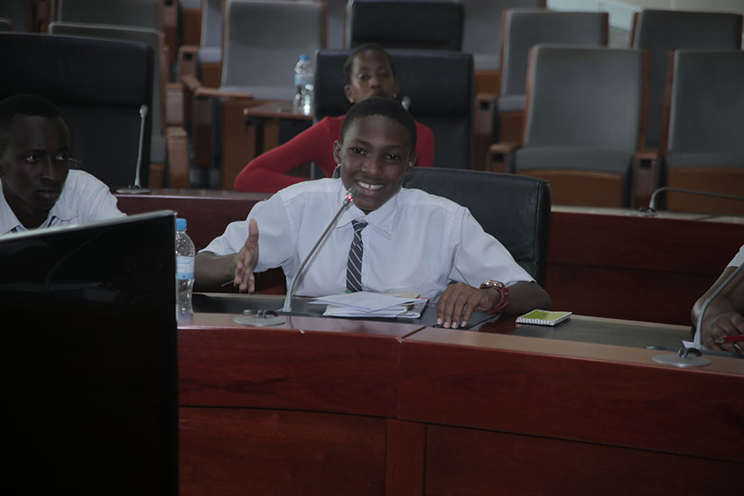 Niyigena, from FAWE Girls School, takes part in the debating competition of Advanced Level category during the event at City Hall yesterday. / Courtesy
