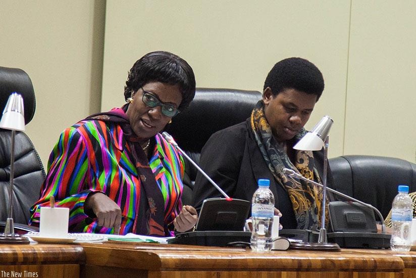 Chairperson of budget and national patrimony committee Mukayuhi  Rwaka  Constance speaks as Deputy Chairperson  of the committee MUKARUGWIZA Annonciata listens during a session in Parliament. Nadege I