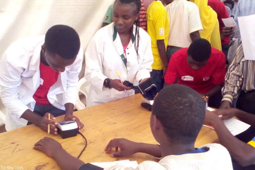 Health experts screen people for various NCDs in Gahengeri, Rwamagana District, last week. / Photo by Lydia Atieno.