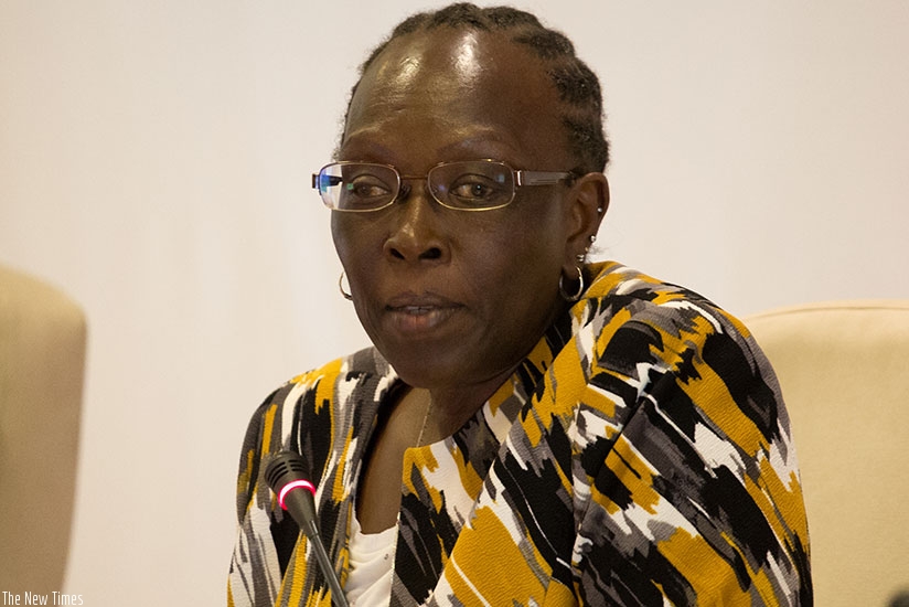 Betty Maina, principal secretary in the Kenyan ministry of labour and EAC affairs, speaks to a journalist. (Timothy Kisambira)