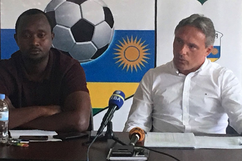 Amavubi head coach Antoine Hey (right) and assistant coach Vincent Mashami (left) at a press briefing at FERWAFA headquarters on Thursday. (courtesy)