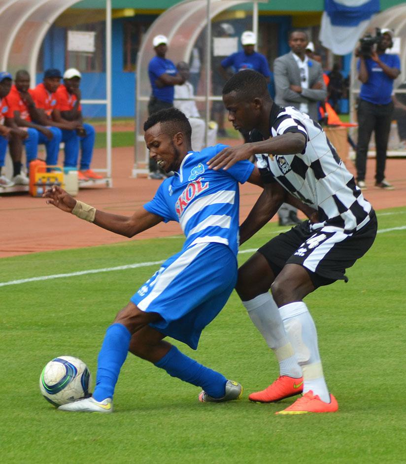 Rayon Sports midfielder Savio Nshuti battles with APR left-back Emmanuel Imanishimwe during the first round game, which the army side won 1-0. The two rivals will meet again on Sunday. / Sam Ngendahimana