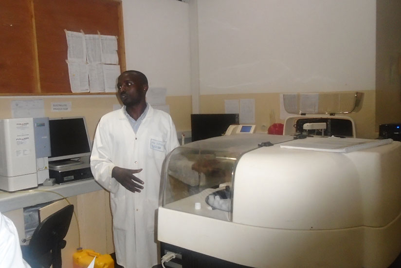 A medic at Butaro Hospital explains how cancer screening is done. / Photo by Lydia Atieno.