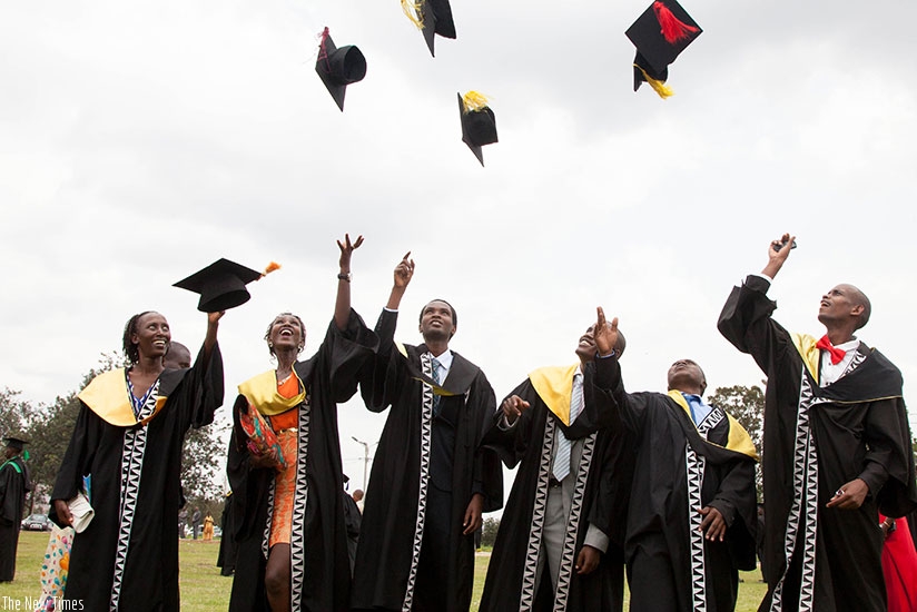 Graduates celebrate during a past graduation. File. 