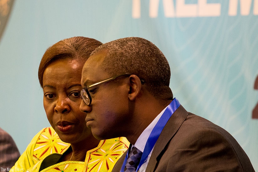 Mushikiwabo (L) speaks to Nzabamwita during the meeting in Kigali.Timothy Kisambira.