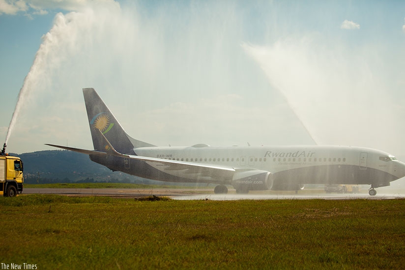 RwandAir's new Boeing 737-800 is welcomed by the fireman salute at Kigali International Airport yesterday. (All photos by Timothy Kisambira)