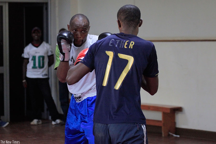 Vincent Nsengiyumva in training with national team coach Jean Claude Gatorana in preparation for the African Boxing Championships. S. Ngendahimana