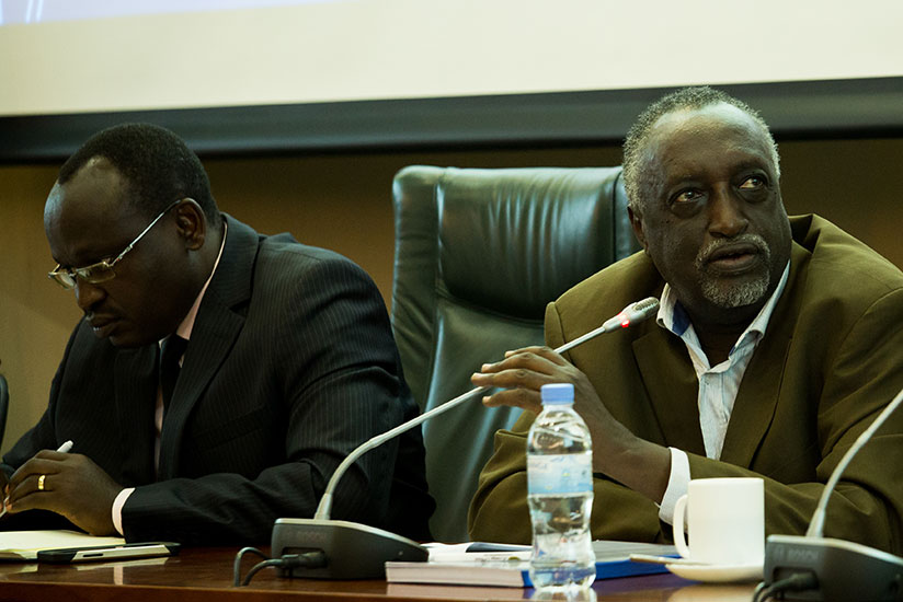 Senator Tito Rutaremara speaks as Sindikubwabo looks on in Kigali, yesterday. /Timothy Kisambira