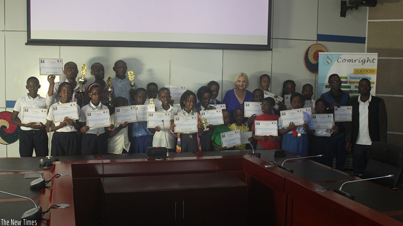 Participants in the national spelling bee pose for a group photo after the event. (Francis Byaruhanga)