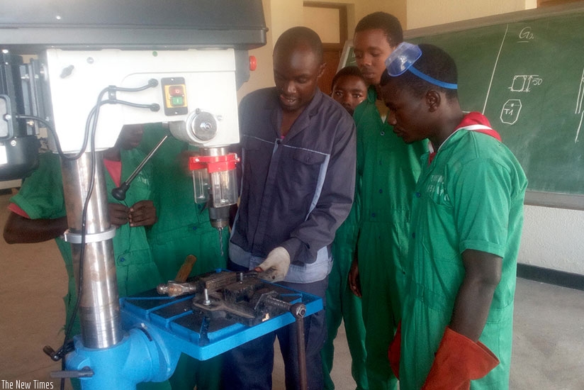 Yves Lambert Kwizera (right) with fellow students in a practical lesson at Kavumu Traning Centre in Nyanza District. (Photos by Remy Niyingize)